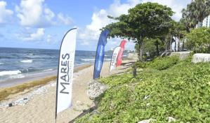 Sistema Coca-Cola realiza jornada de limpieza en la playa de Güiba