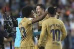 Lewandowski salva a Barcelona, que se impone a Valencia