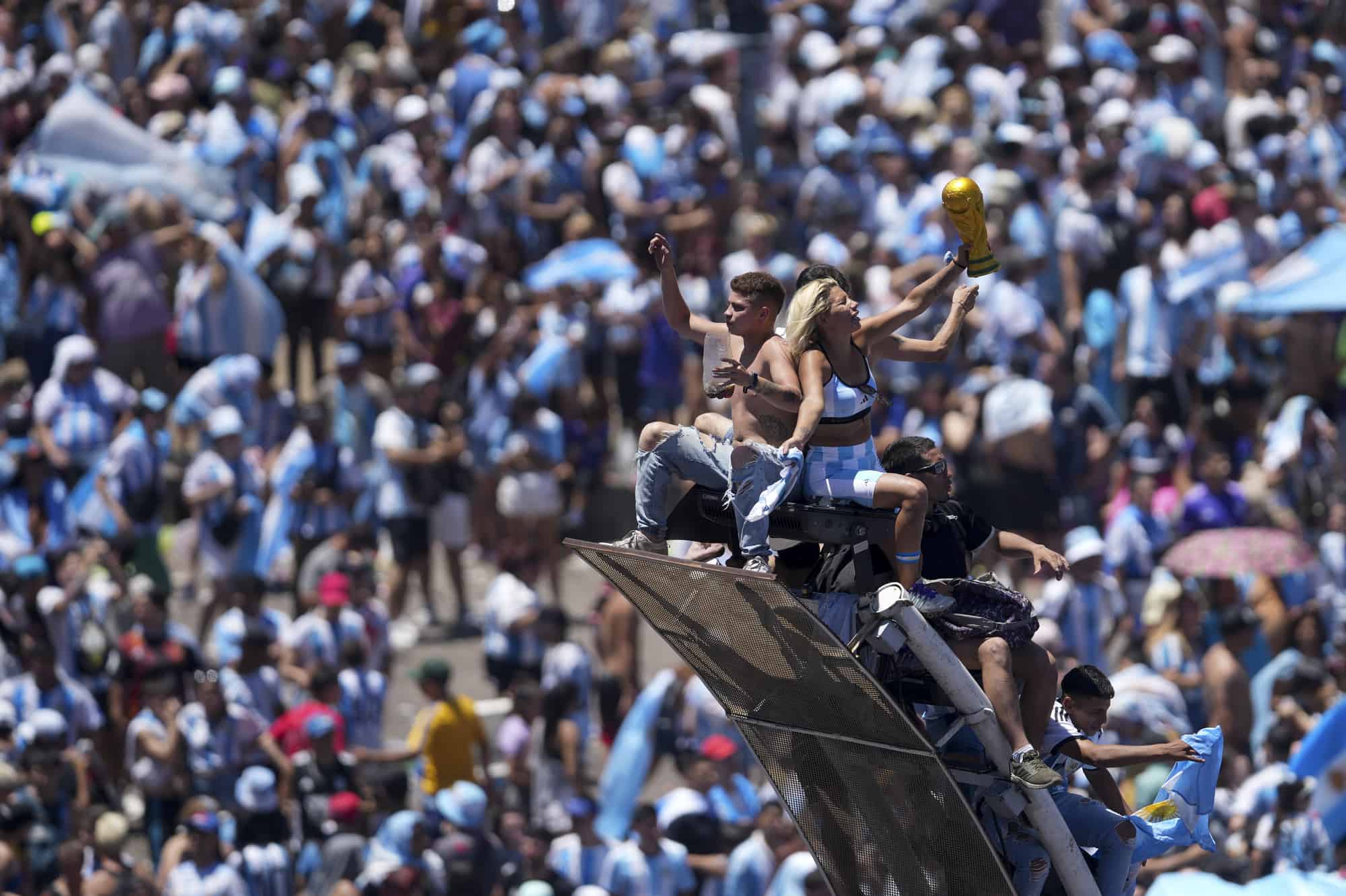 Soccer fans welcome home the Argentine soccer team after it won the World Cup title, in Buenos Aires, Argentina, Tuesday, Dec. 20, 2022.