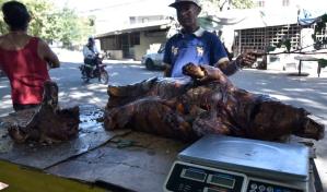 Baja demanda de carne de cerdo asado en Santiago en víspera de Nochebuena
