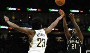 Holiday enciende una reacción tardía y Bucks superan a Pacers