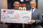 Taxista que se ganó RD$20 millones de la Loto se mudará al campo