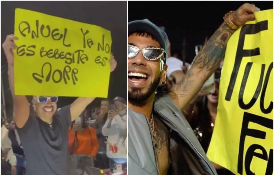 Doble de Feid se pasea por las calles con cartel para Anuel  y le dice que Karol G no es su bebecita