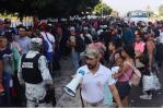 Migrantes protestan en la frontera sur de México en vísperas de la cumbre migratoria