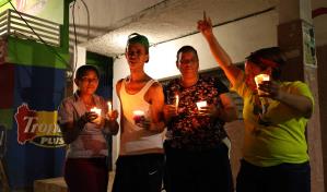 Defensores de Kiko la Quema en Cambita Garabitos encienden velas por su muerte
