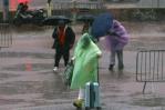 Downpours in Barcelona paralyze trains while soldiers search for victims of floods in Valencia