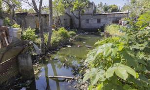 Residentes en comunidad de Los Alcarrizos solicitan remozamiento de cañada