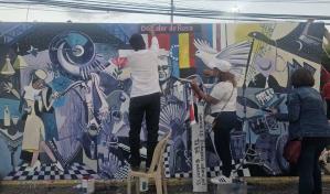 Artistas plásticos pintan mural en honor a víctimas del Jet Set