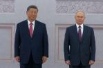 Putin y Xi muestran su sintonía en el Kremlin, Ucrania denuncia la violación de la tregua