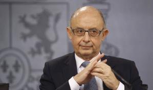 El exministro de Hacienda español del Gobierno de Rajoy (derecha) imputado por corrupción