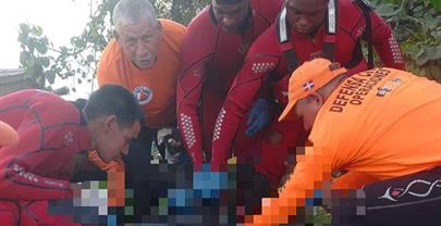 Defensa Civil recupera el cuerpo del motorista que cay&oacute; al r&iacute;o Isabela durante accidente de tr&aacute;nsito