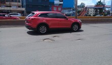 Lluvias y desgaste del asfalto provocan que calles y avenidas del GSD se llenen de hoyos