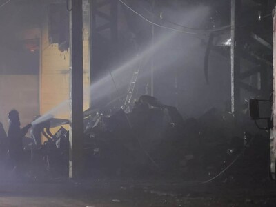Firefighters Battle Over 10-Hour Blaze at Santo Domingo Store; Looters Arrested