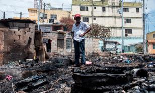 Afectados por incendio en Villa Duarte claman por ayuda de las autoridades