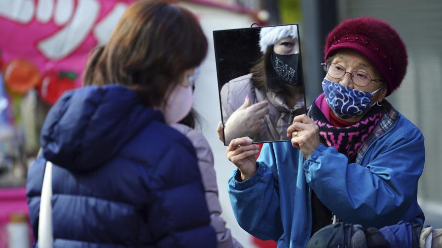 Casos de COVID-19 repuntan en China, que recibe a la OMS
