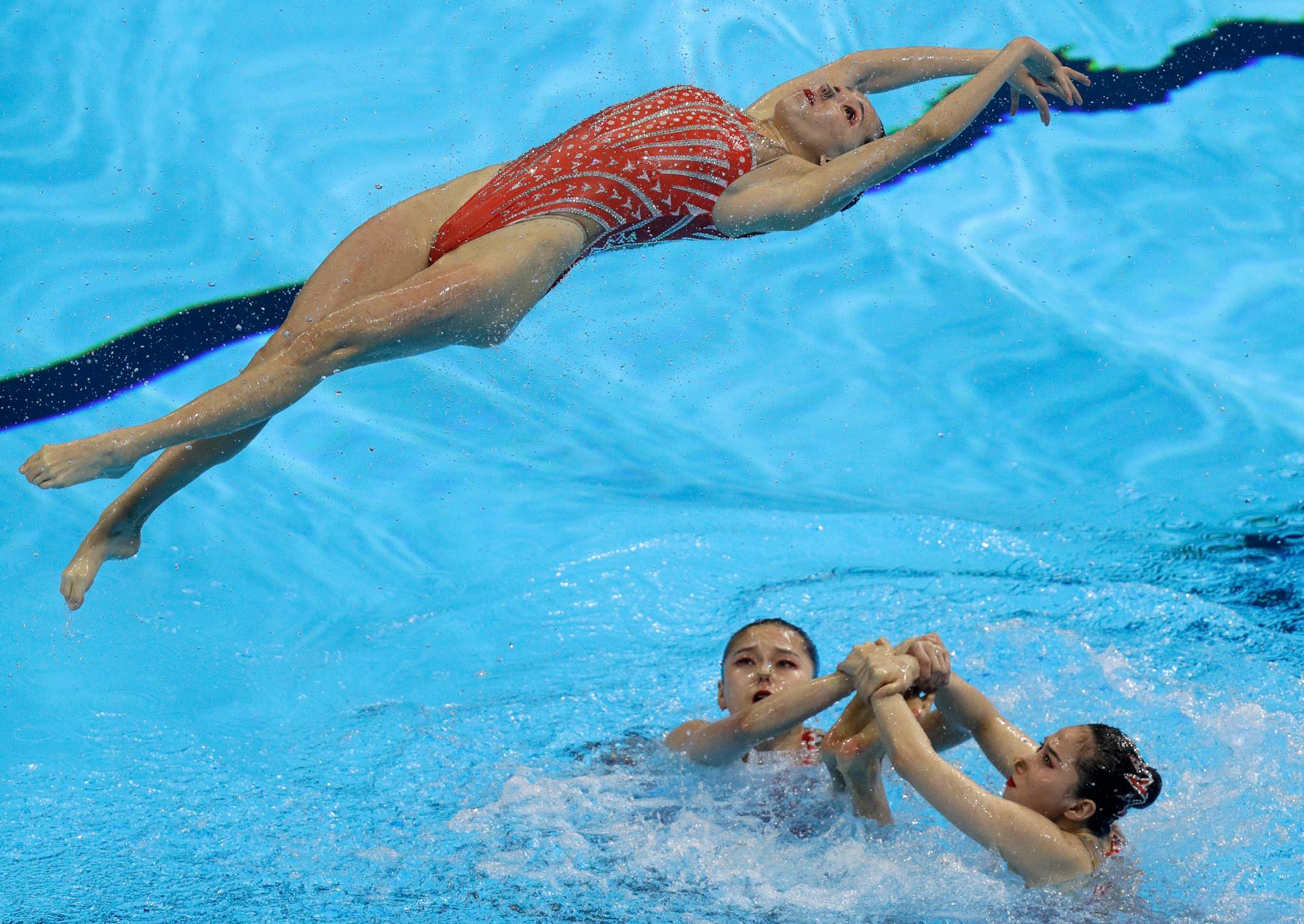 China realiza su rutina en la preparación técnica artística del equipo de natación en el Campeonato Mundial de Natación en Gwangju, Corea del Sur, domingo 14 de julio de 2019.