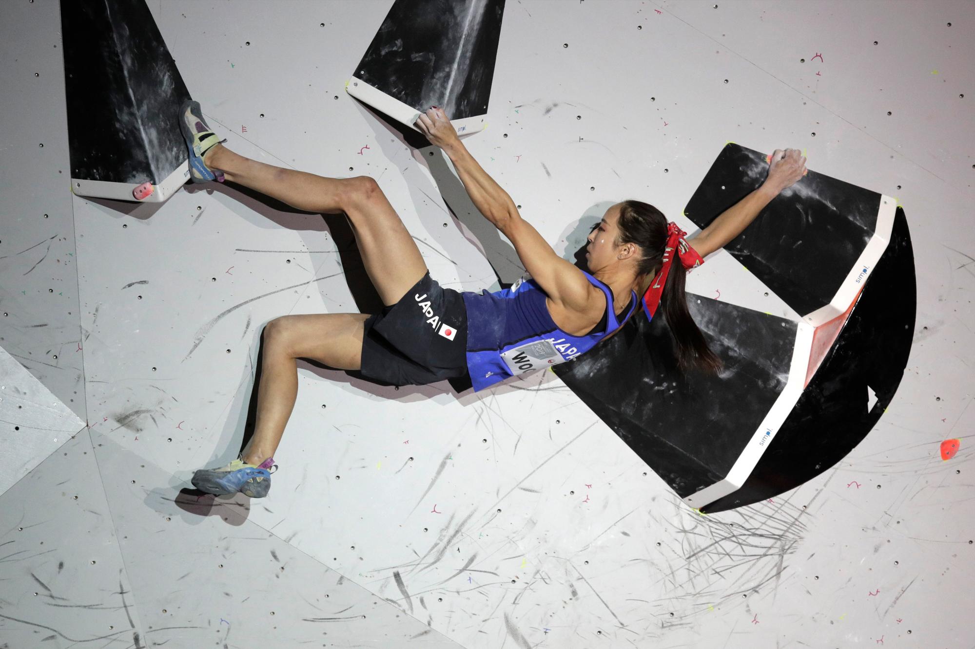 Akiyo Noguchi, of Japan, competes during the womens combined bouldering final at the International Federation of Sport Climbing World Championships Tuesday, Aug. 20, 2019, in Tokyo. (AP Photo/Jae C. Hong)