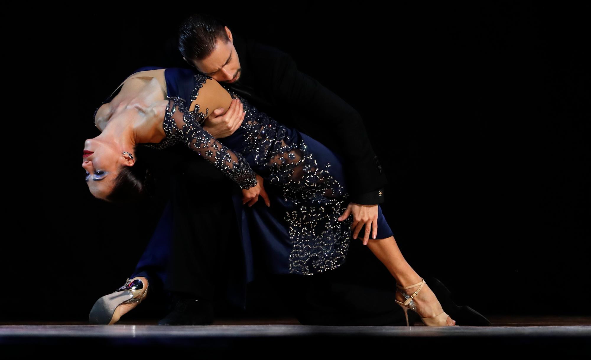 Dmitriy Kuznetsov and Olga Nikolaeva, from Russia, compete in the Stage category final at the annual Tango Dance World Championship in Buenos Aires, Argentina, Wednesday, Aug. 21, 2019. 