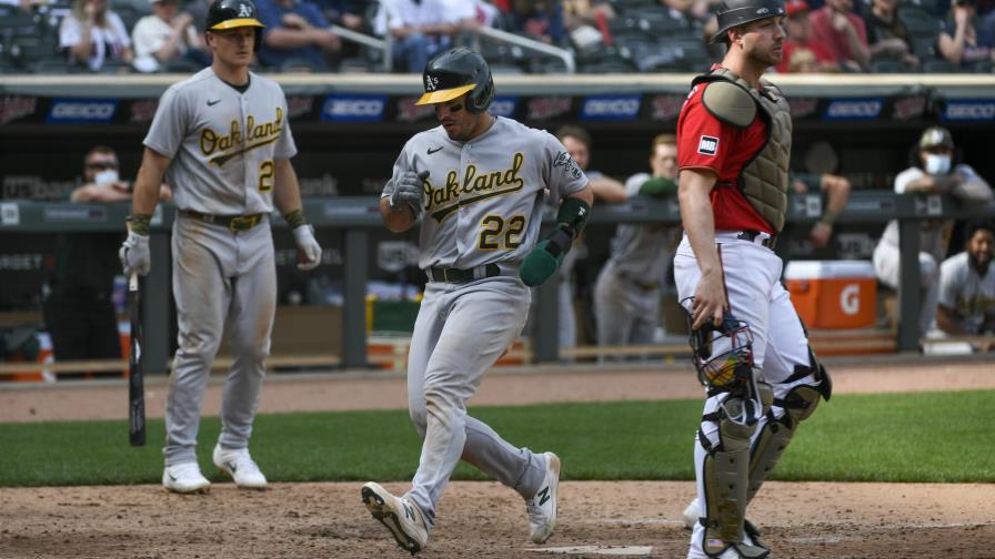 Laureano anota en wild pitch y Atléticos ganan en Minnesota
