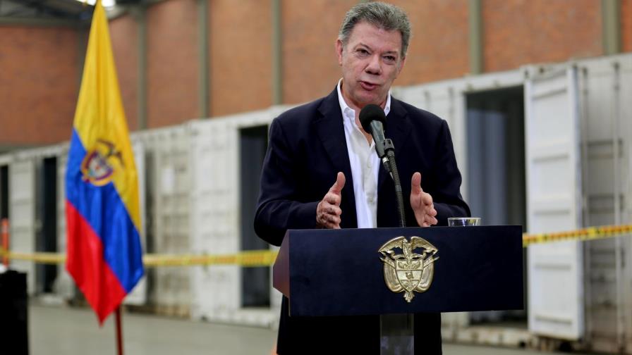 Santos firma decreto para iniciar alto el fuego con ELN a partir de domingo Santos firma decreto para iniciar alto el fuego con ELN a partir de domingo