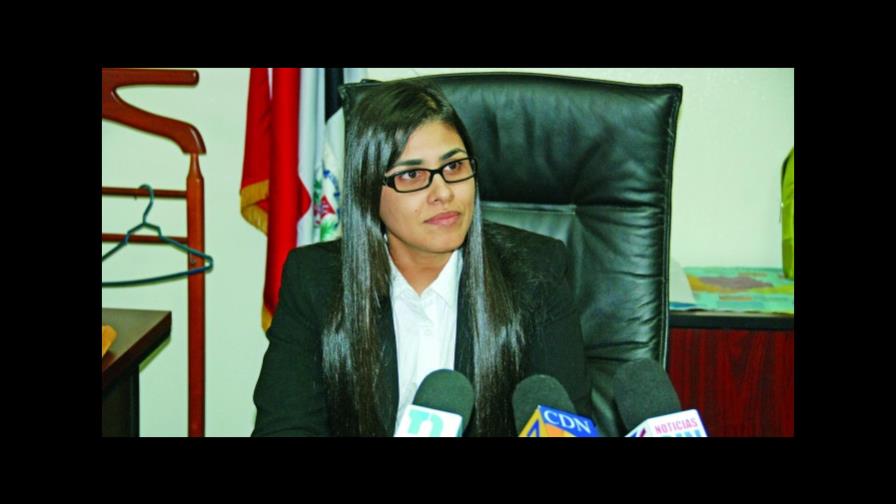 Fiscal Olga Diná explica foto junto a exdirector de la OMSA 