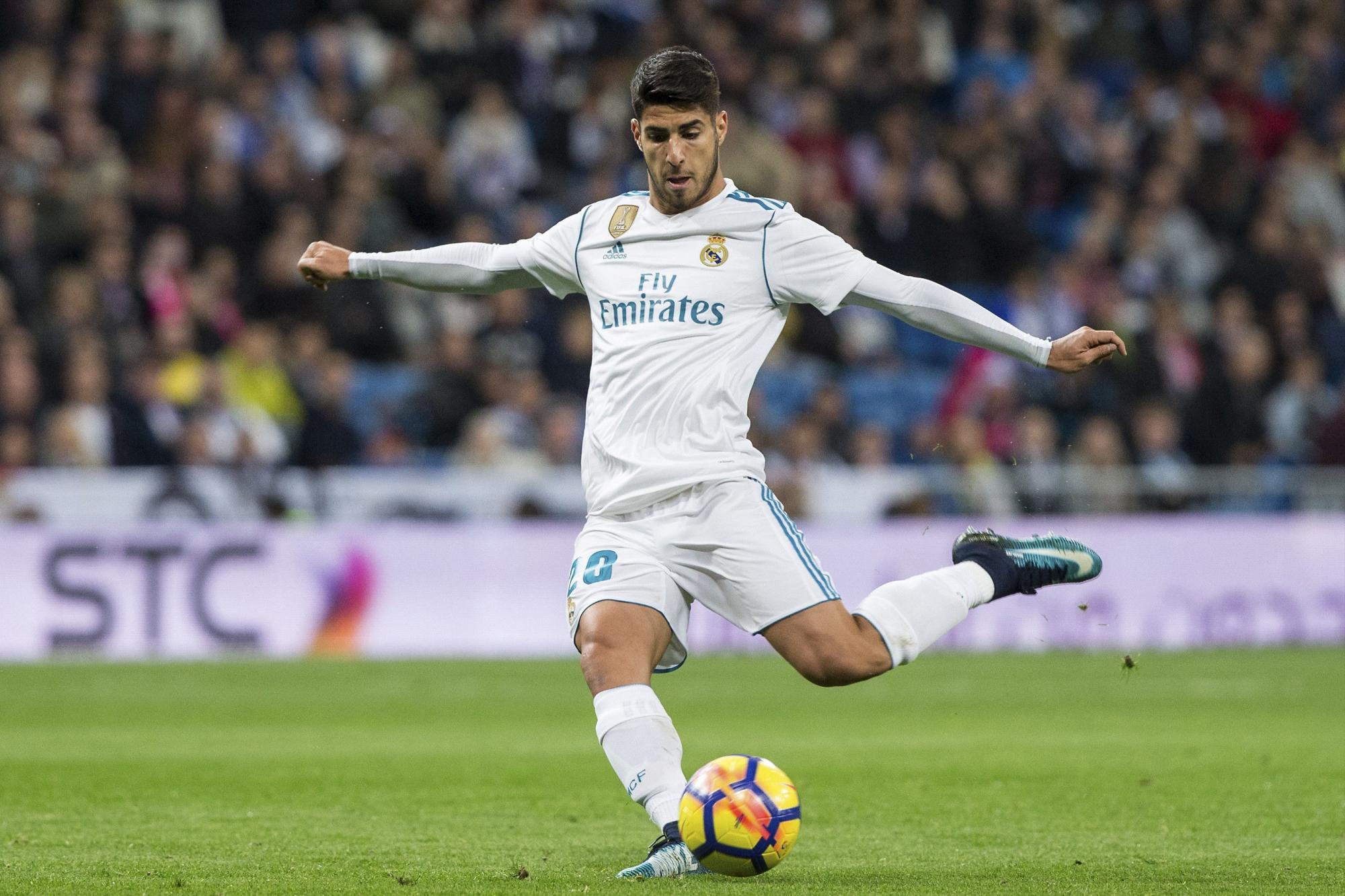 El centrocampista del Real Madrid Marco Asensio, durante el partido de Liga en Primera División ante Las Palmas disputado esta noche en el estadio Santiago Bernabéu, en Madrid. 