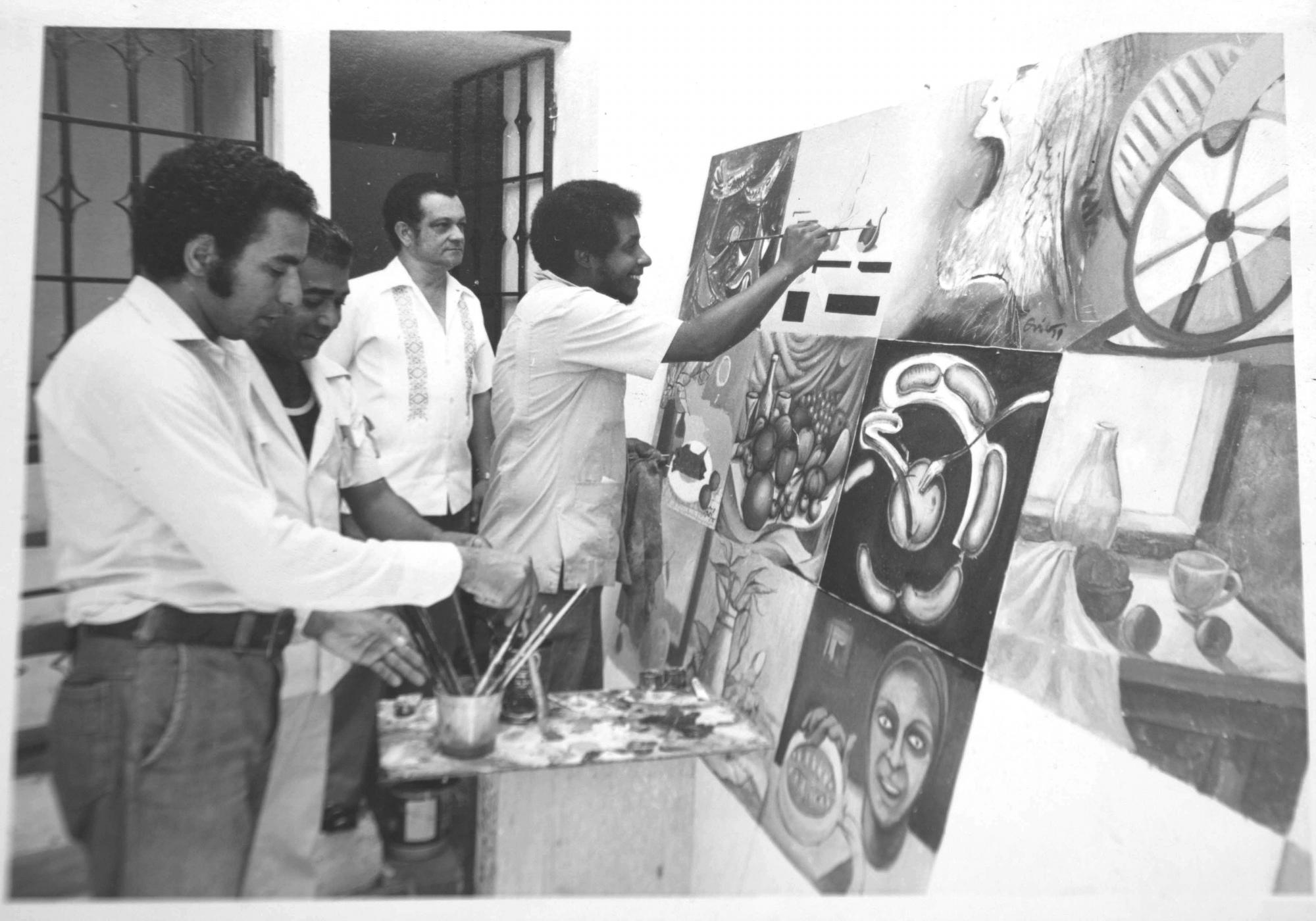 Algunos de los pintores participantes, en plena faena.