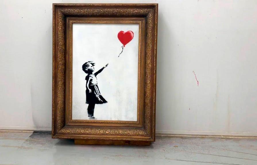 El cuadro “Niña con globo” de Banksy vendido en 18,6 millones de libras, un récord para el artista