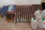 Desmantelan procesadora de alcohol clandestina y apresan fabricante con armas en San Pedro de Macorís