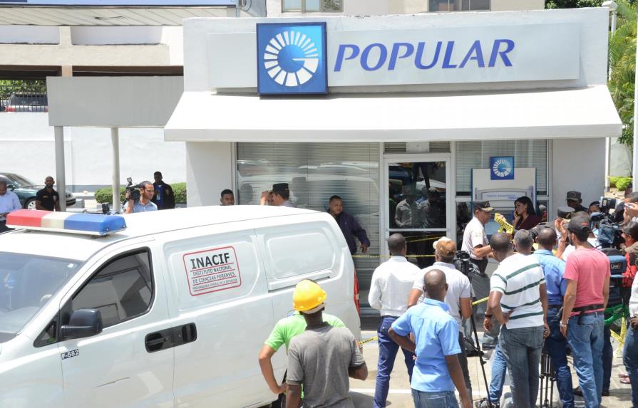 La Policía apresa a tres y persigue a cuatro por asalto al Banco Popular 