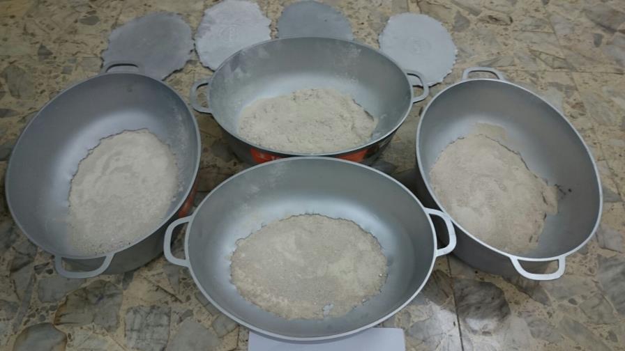 DNCD ocupa 8.24 kilogramos de heroína escondida en calderos a una colombiana en el AILA