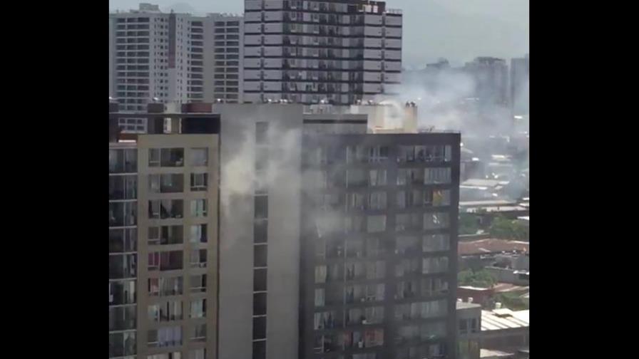 Mueren dominicana y su hijo tras lanzarse de edificio incendiado en Chile