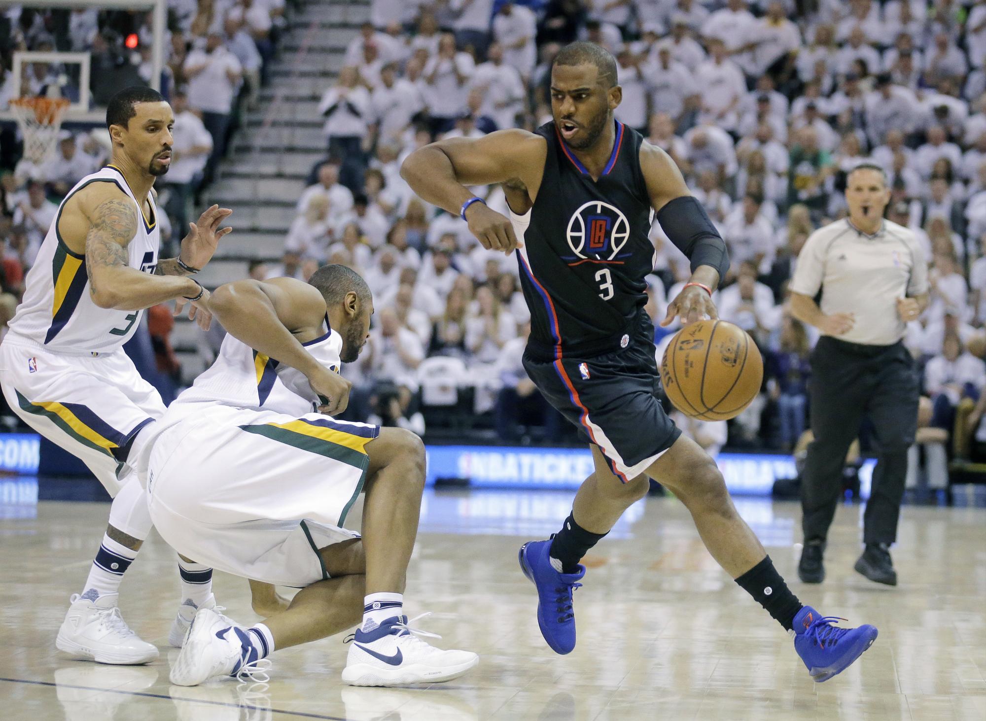 Los Angeles Clippers guard Chris Paul (3) drives around Utah Jazzs George Hill (3) and Boris Diaw, center, during the first half in Game 6 of an NBA basketball first-round playoff series Friday, April 28, 2017, in Salt Lake City. Los Angeles Clippers guard Chris Paul (3) drives around Utah Jazzs George Hill (3) and Boris Diaw, center, during the first half in Game 6 of an NBA basketball first-round playoff series Friday, April 28, 2017, in Salt Lake City.