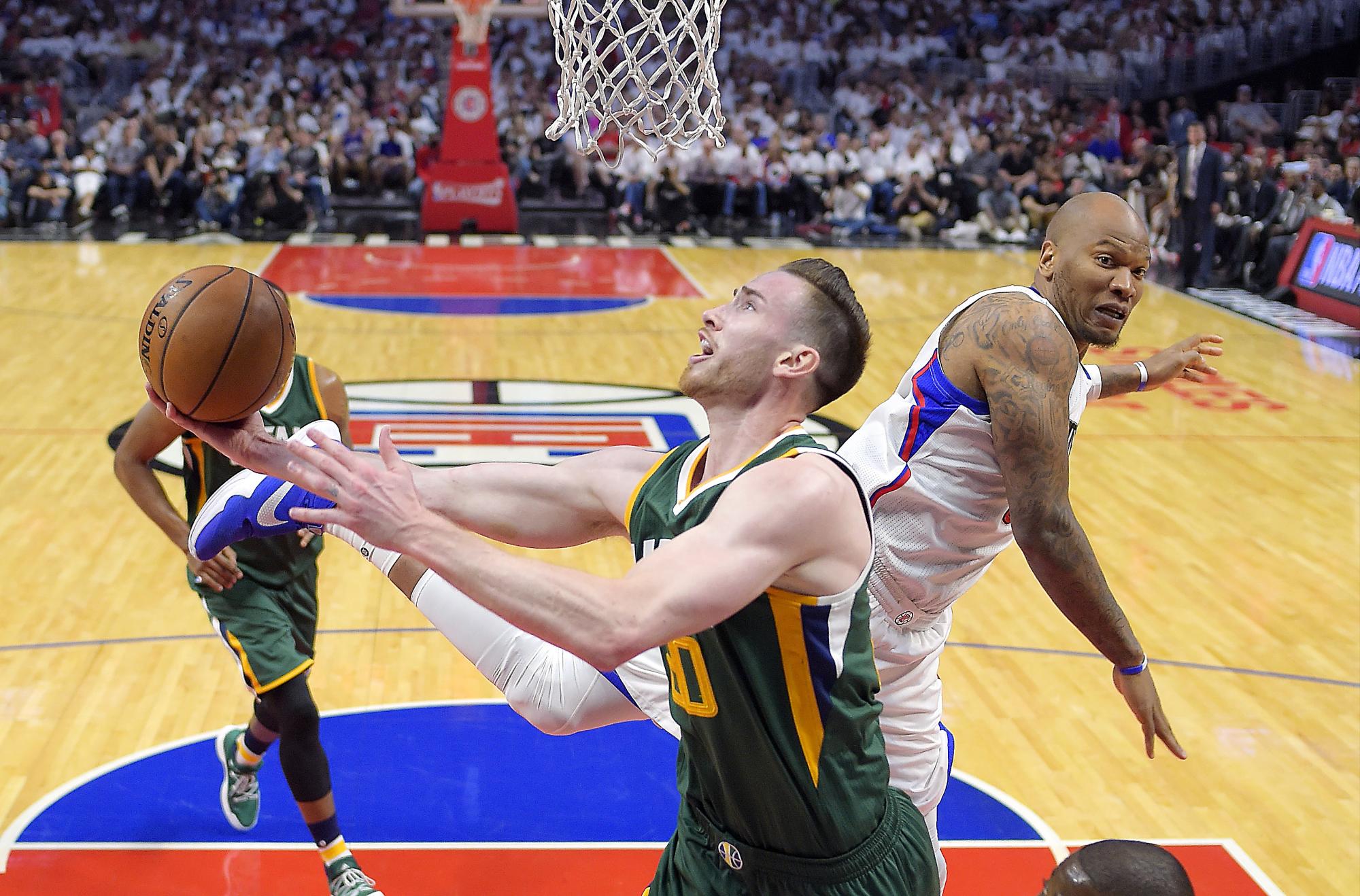 Utah Jazz forward Gordon Hayward, left, shoots as Los Angeles Clippers center Marreese Speights defends during the second half in Game 7 of an NBA basketball first-round playoff series, Sunday, April 30, 2017, in Los Angeles. The Jazz won 104-91. Utah Jazz forward Gordon Hayward, left, shoots as Los Angeles Clippers center Marreese Speights defends during the second half in Game 7 of an NBA basketball first-round playoff series, Sunday, April 30, 2017, in Los Angeles. The Jazz won 104-91.