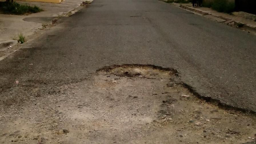 Vecinos de Savica en Santo Domingo Este demandan bacheo en calle Penetración 