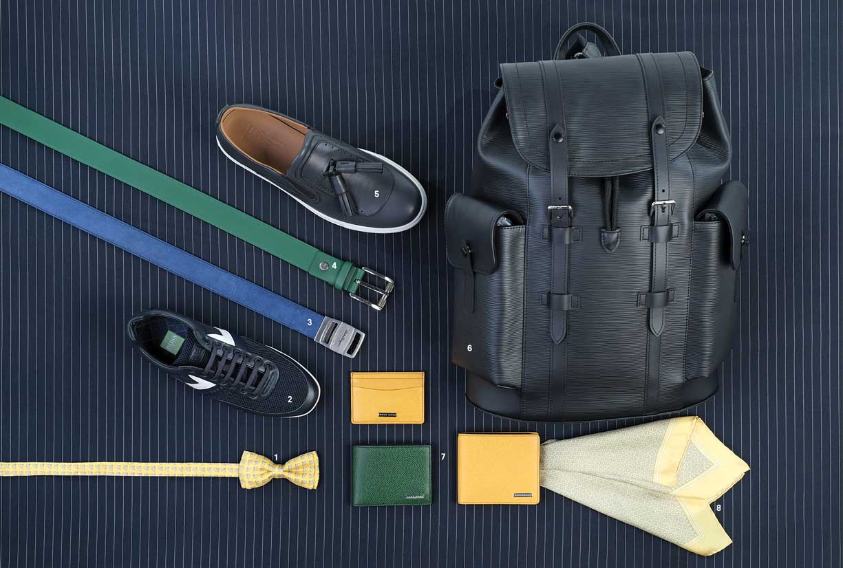 Relajado. 1,3,5 y 8. Corbatín de seda, cinturón en suede y hebilla de metal, calzado en piel y pañuelo de seda, de Salvatore Ferragamo. 2,4 y 7. Calzado deportivo, cinturón en piel con hebilla de metal y juego de carteras en piel, de Hugo Boss. 6. Mochila en piel, de Louis Vuitton.