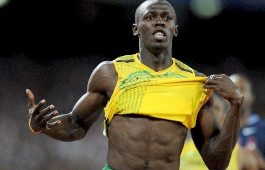 Ussain Bolt corona oro con récord mundial en 100m