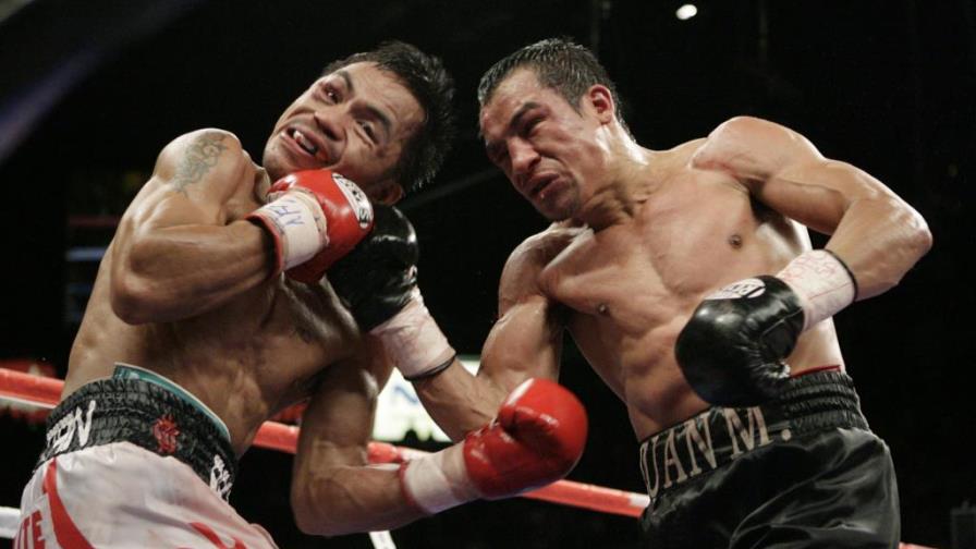 Manny Pacquiao vence a Juan Manuel Márquez por decisión dividida Manny Pacquiao vence a Juan Manuel Márquez por decisión dividida