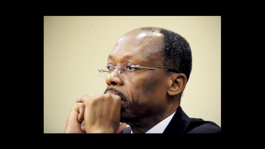 Expresidente haitiano Aristide, denunciado por estafa, declara en domicilio Expresidente haitiano Aristide, denunciado por estafa, declara en domicilio